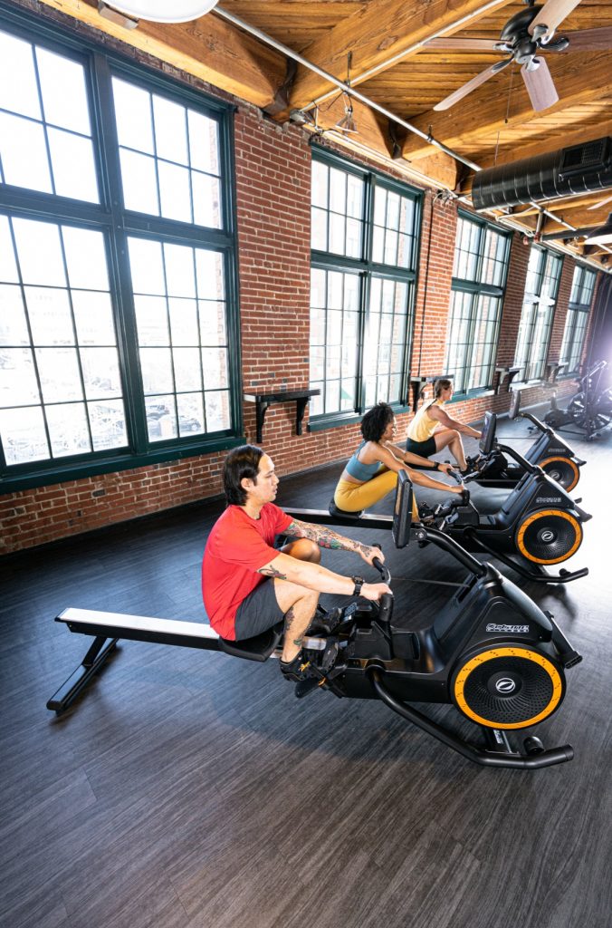 Group of 3 people using Octane Ro commercial rowers